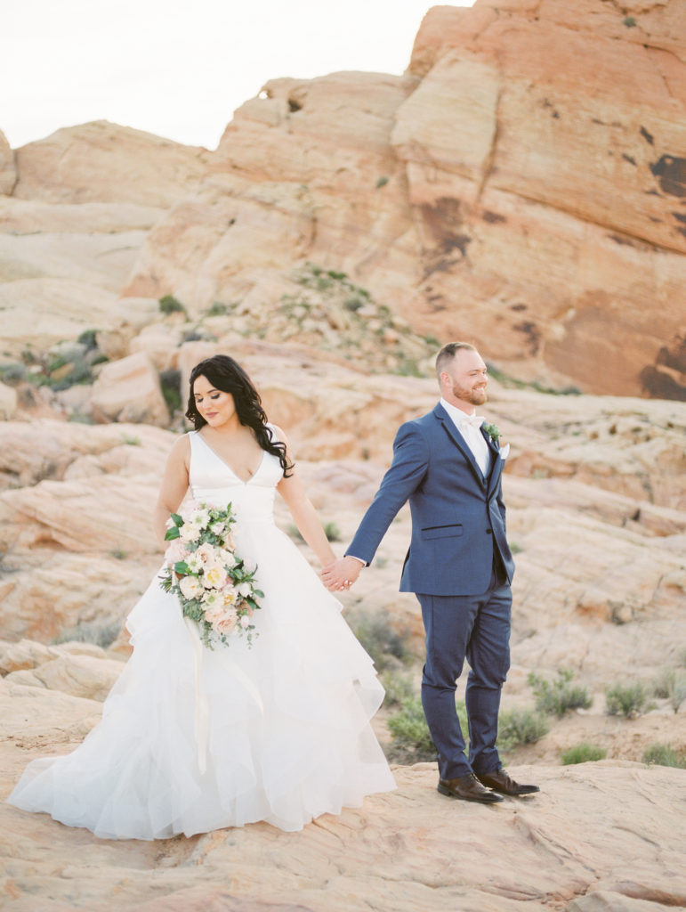 Bride and Groom holding hands - Valley of Fire