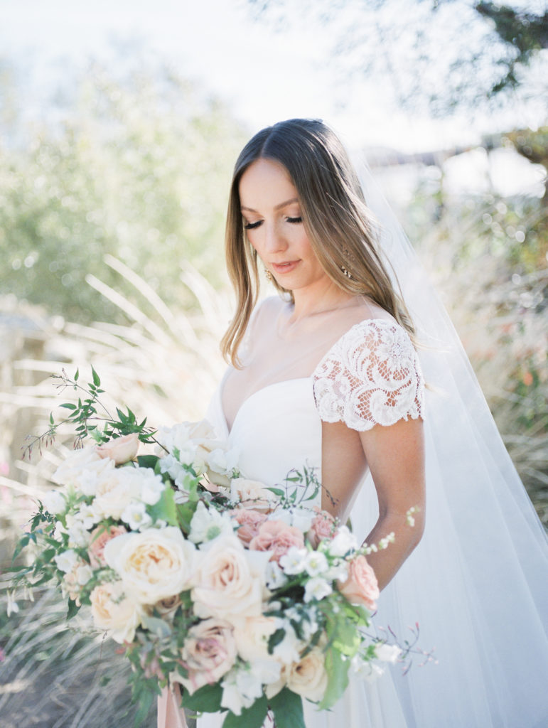springs preserve wedding, bride with floral bouquet and lace gown