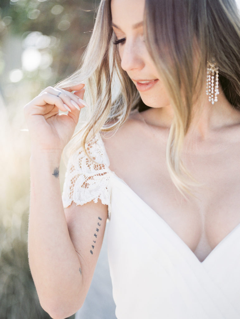springs preserve wedding, bride with earrings and lace gown