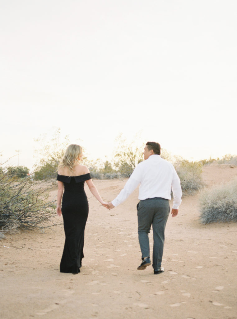 classic desert engagement session lianna marie photography walking away